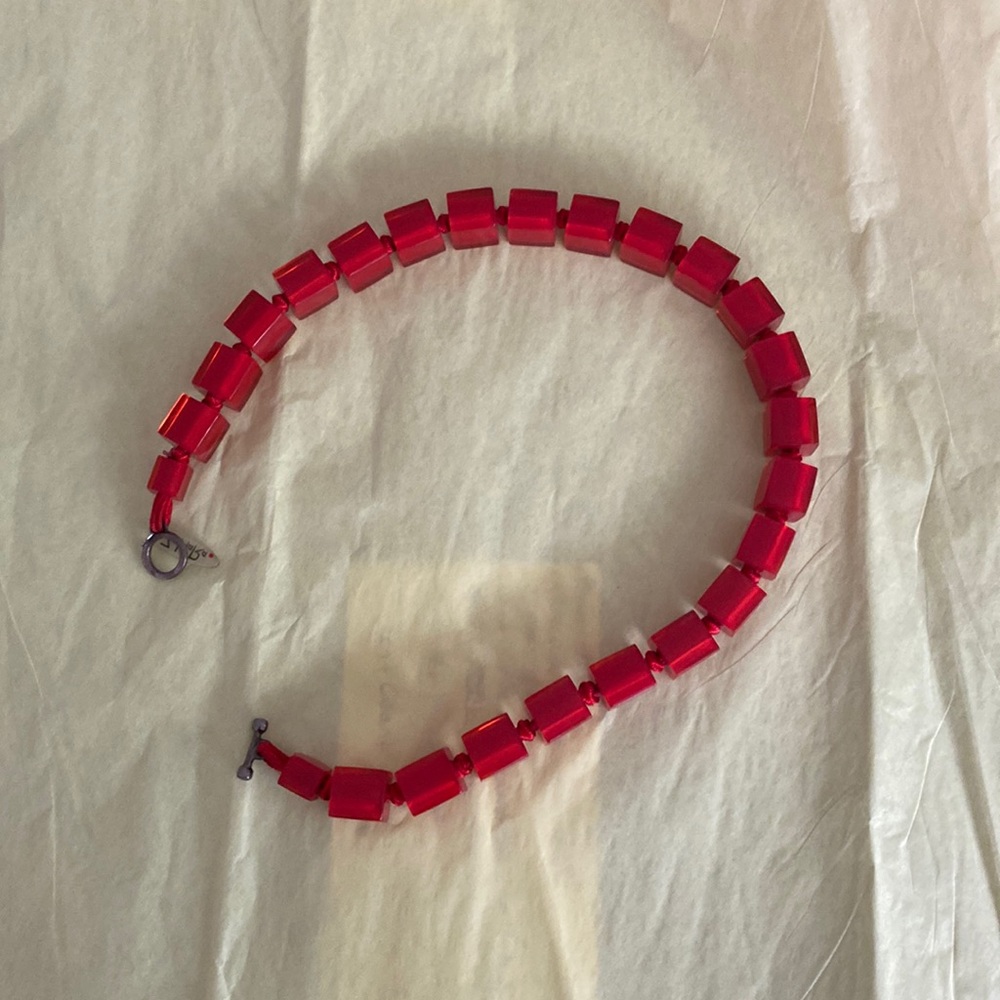 ZHR’s necklace of red plastic squares and knots
